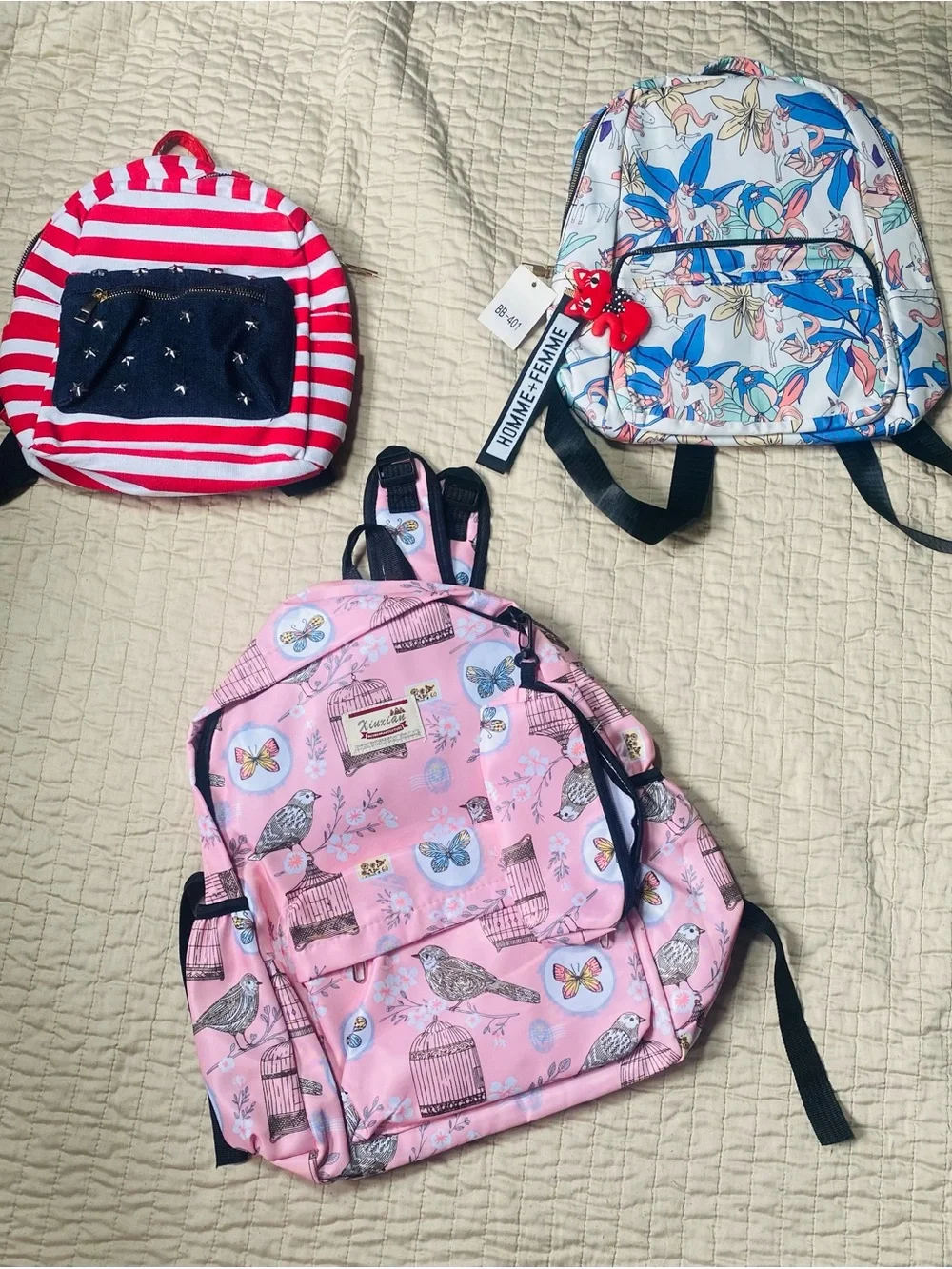 three backpacks of different sizes